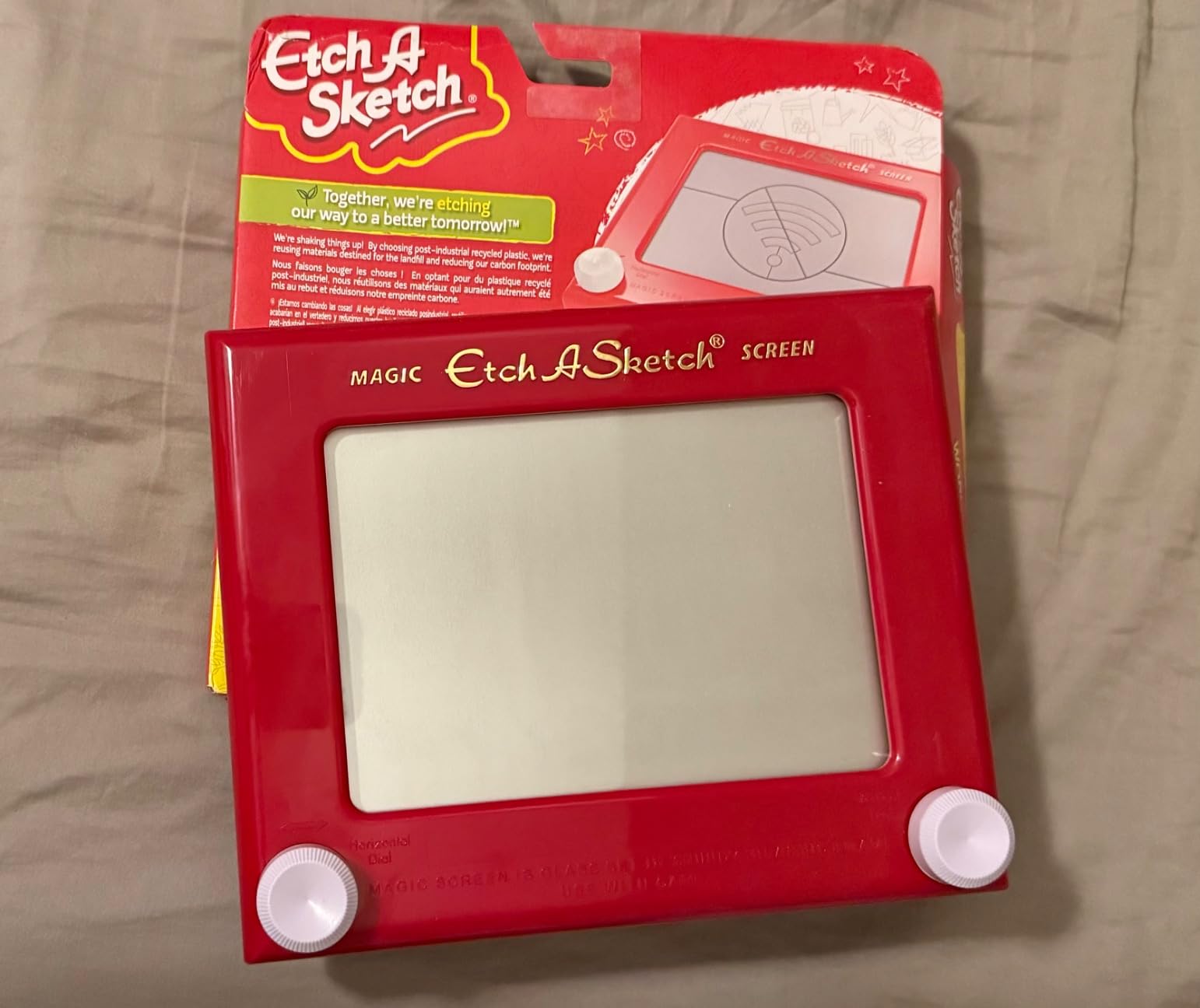 Etch A Sketch, Classic Red Drawing Toy with Magic Screen, for Ages 3 and Up Customer Review Etch A Sketch, Classic Red Drawing Toy with Magic Screen, for Ages 3 and Up - Customer Photo 1
