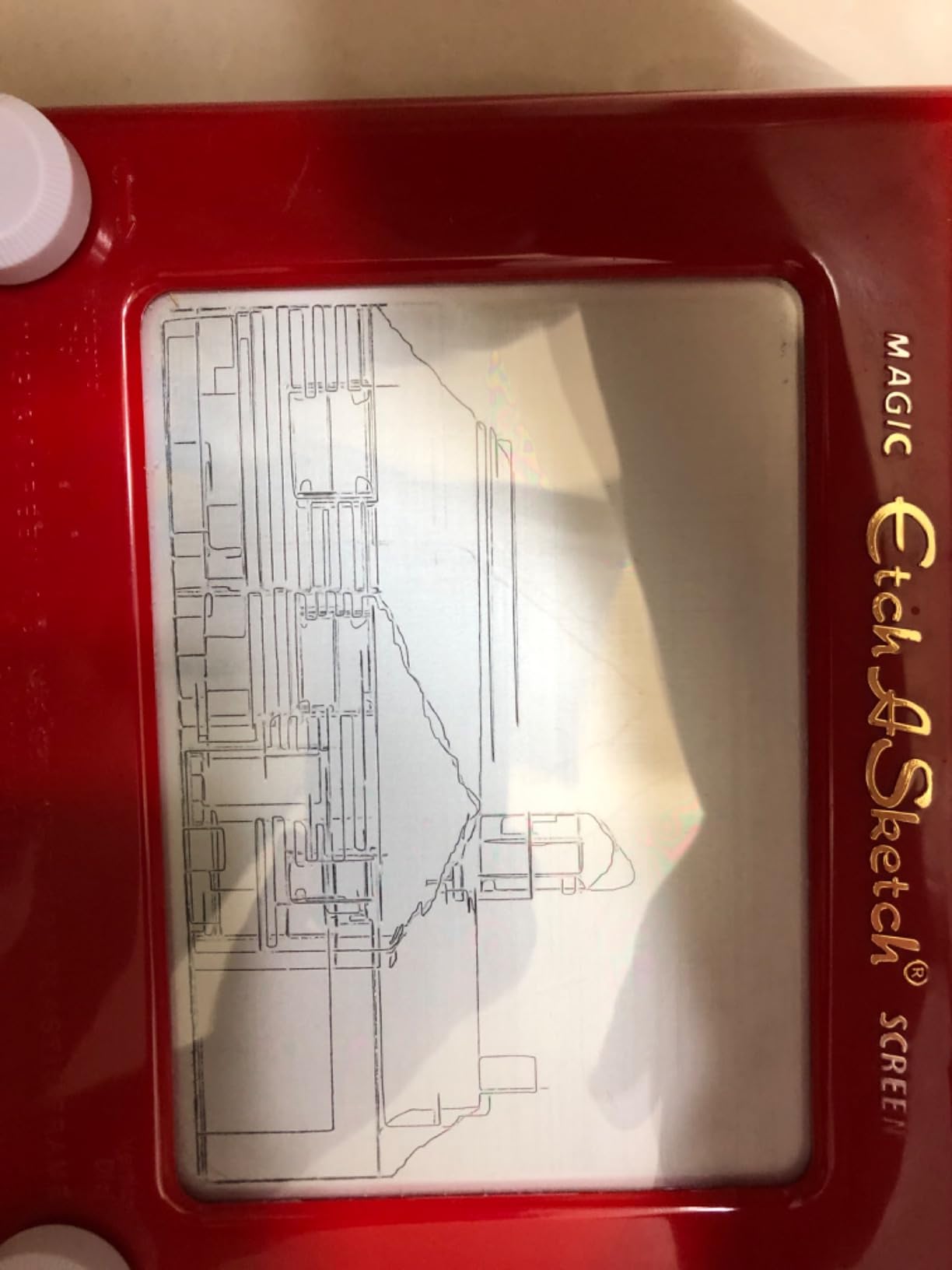 Etch A Sketch, Classic Red Drawing Toy with Magic Screen, for Ages 3 and Up Customer Review Etch A Sketch, Classic Red Drawing Toy with Magic Screen, for Ages 3 and Up - Customer Photo 2