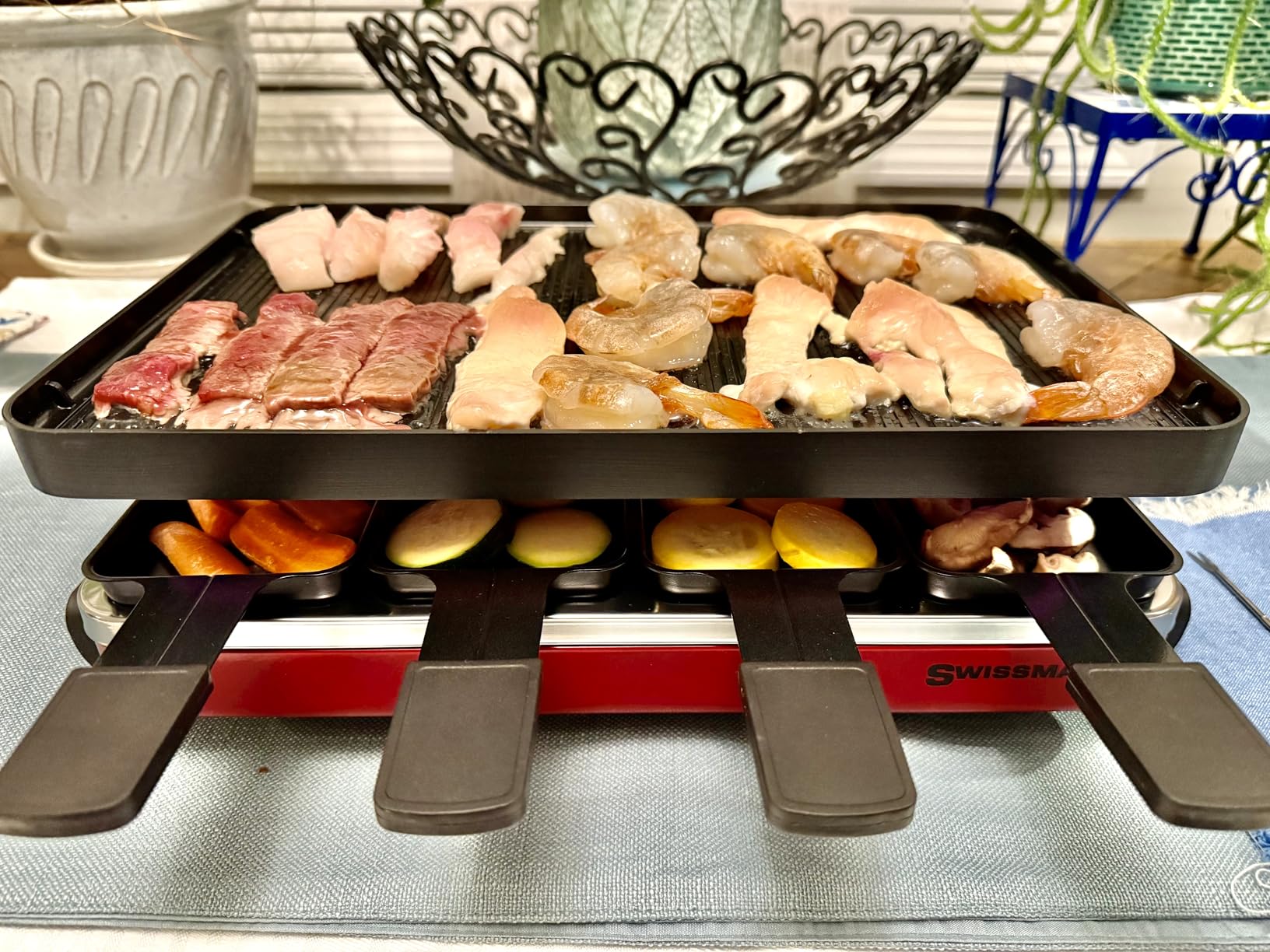 Swissmar Classic 8-Person Raclette Party Grill with Reversible Cast Iron Grill Plate/Crepe Top, Indoor Electric Raclette Grill & Griller - Red customer photo 1