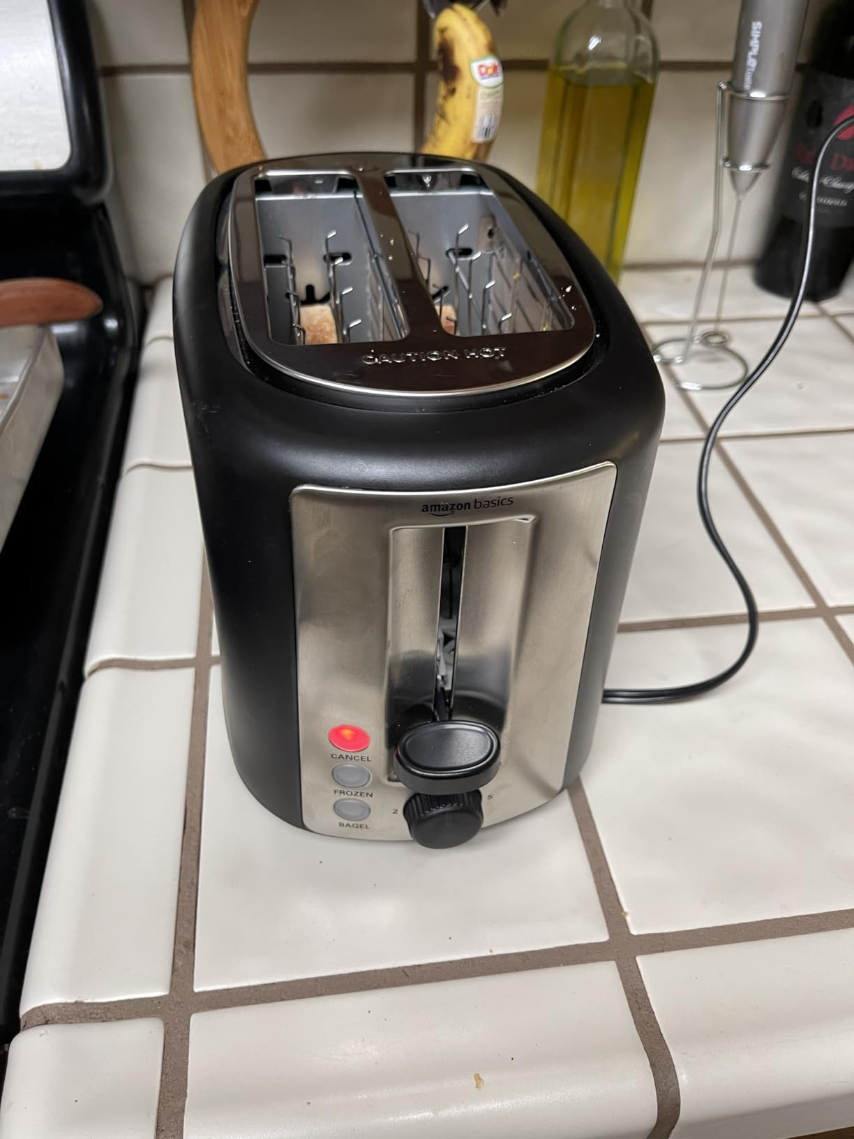 Amazon Basics 2 Slice Toaster, Extra Wide Slots for Bagels, 6 Browning Settings, Removable Crumb Tray, Defrost/Cancel/Bagel Buttons, Cord Wrap, 900W, Black & Silver customer photo 1