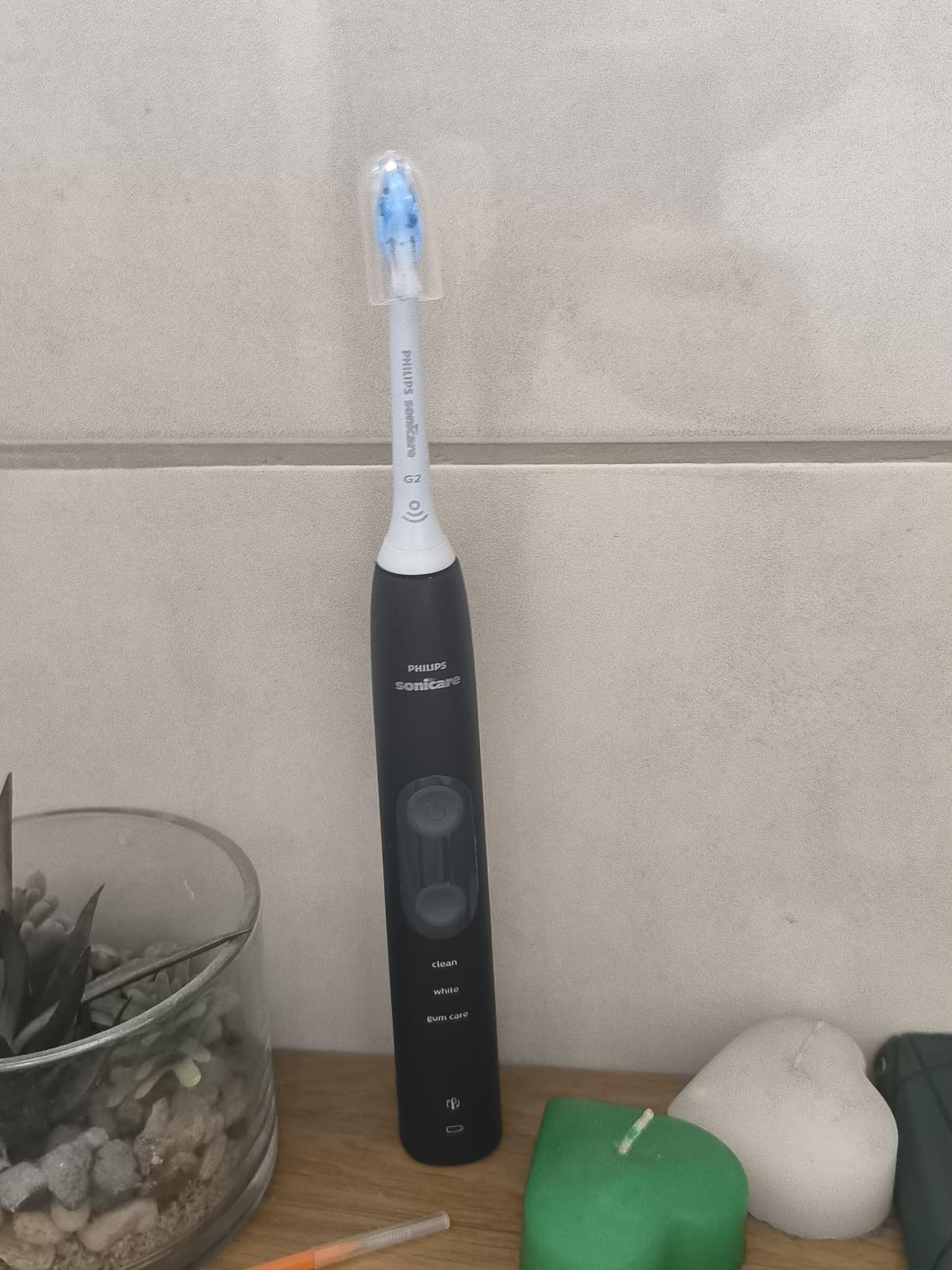 Philips Sonicare ProtectiveClean 5300 Rechargeable Electric Toothbrush, with Pressure Sensor, 3 Cleaning Modes, SmarTimer and QuadPacer, with 2 Bonus Brush Heads, Travel Case, Black, Model HX6423/34 customer photo 1
