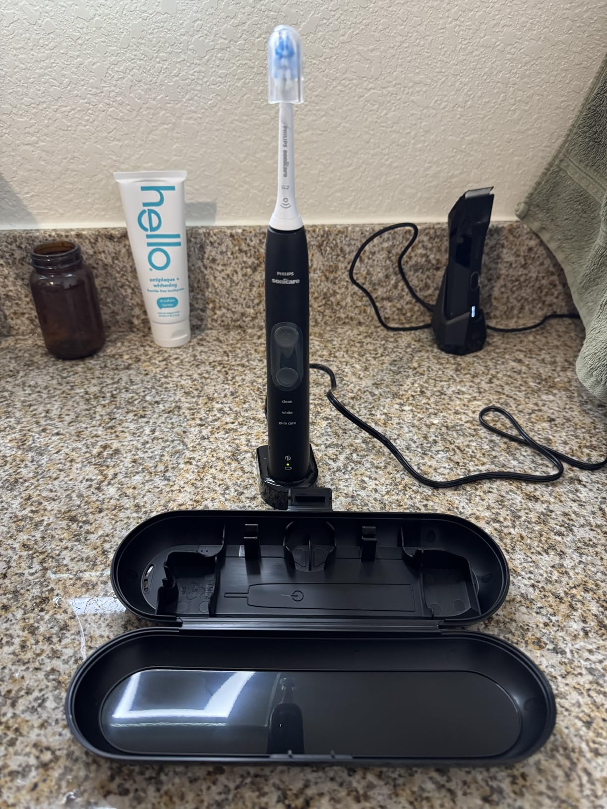 Philips Sonicare ProtectiveClean 5300 Rechargeable Electric Toothbrush, with Pressure Sensor, 3 Cleaning Modes, SmarTimer and QuadPacer, with 2 Bonus Brush Heads, Travel Case, Black, Model HX6423/34 customer photo 2