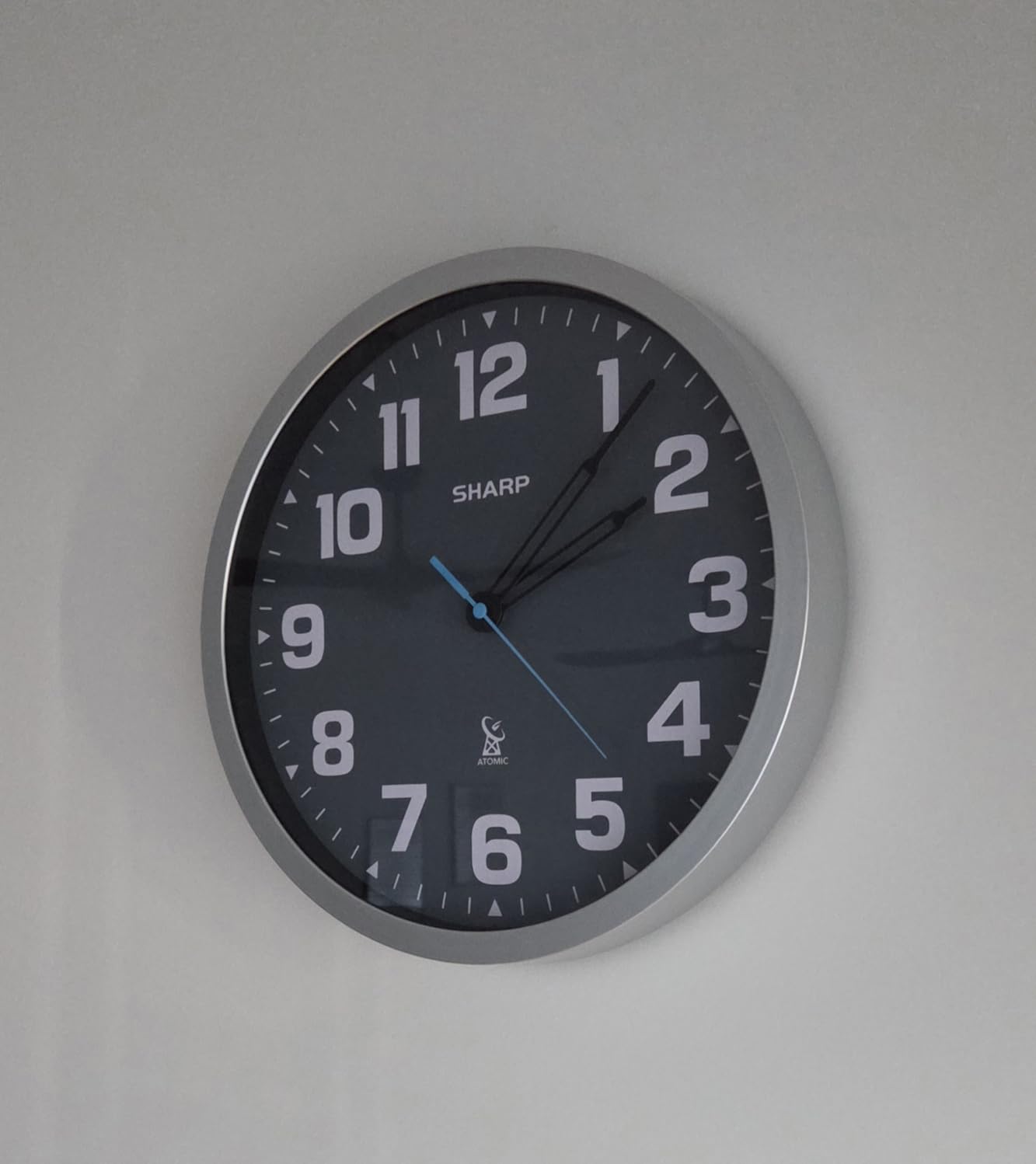 Sharp 12-Inch Atomic Wall Clock, Battery Operated, White with Black Frame | Self-setting atomic time; Easy-read analog face; Automatic time adjustment; Simple setup; Versatile home or office style customer photo 1