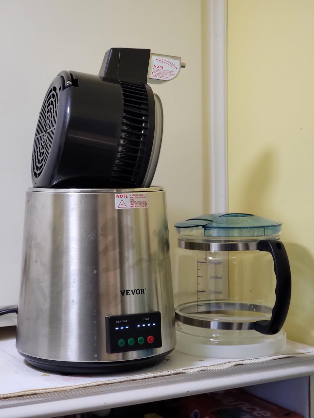 VEVOR 1.1 Gal Water Distiller, 0.3 Gal/H, Distilled Water Maker Machine 750W 0-99H Timing Set Temp Display, 304 Stainless Steel Countertop Distiller Glass Carafe Cleaning Powder 3 Carbon Packs, Silver customer photo 1