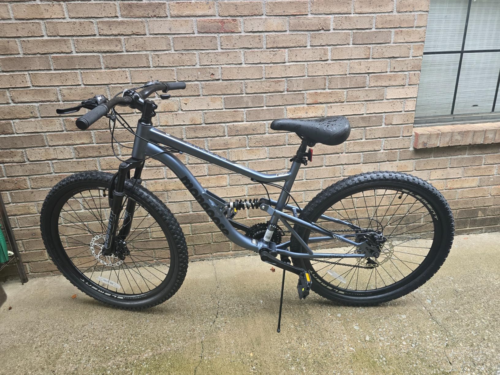 Mongoose Status Mountain Bike, 26 Inch Bike for Men and Women, 21 Speed, Aluminum Suspension Frame, Steel Rear Triangle, Suspension Fork, Knobby Mountain Tires, Mechanical Disc Brakes customer photo 1