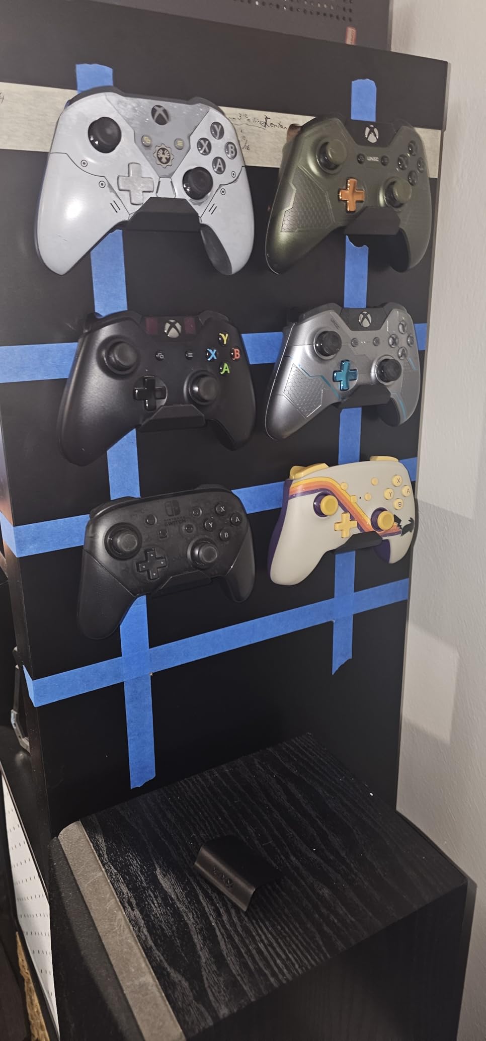 KUNSLUCK 6 Pack Controller Wall Mount - Universal Game Controller Holder for PS5, Xbox, Switch - Adhesive or Screw Installation - Headset & Controller Storage Hook (Black) customer photo 1