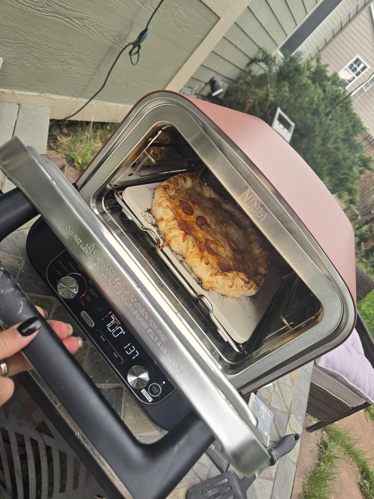 Ninja Woodfire Outdoor Pizza Oven, 8-in-1 Portable Electric Roaster Oven, Heats up to 700°F, 5 Artisan Pizza Settings, Integrated BBQ Smoker Box, Includes Flavored Wood Pellets, Terracotta Red customer photo 1