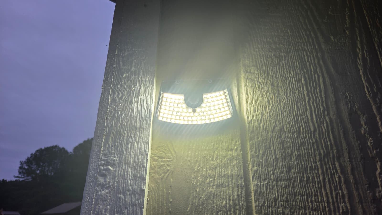 HMCITY 120 LED Outdoor Solar Lights with Motion Sensor and 3 Lighting Modes, IP65 Waterproof Wide Solar Wall Lights Ideal for Garden Patio Yard (Front Button 6Packs, Black Shell-Daylight White) customer photo 1