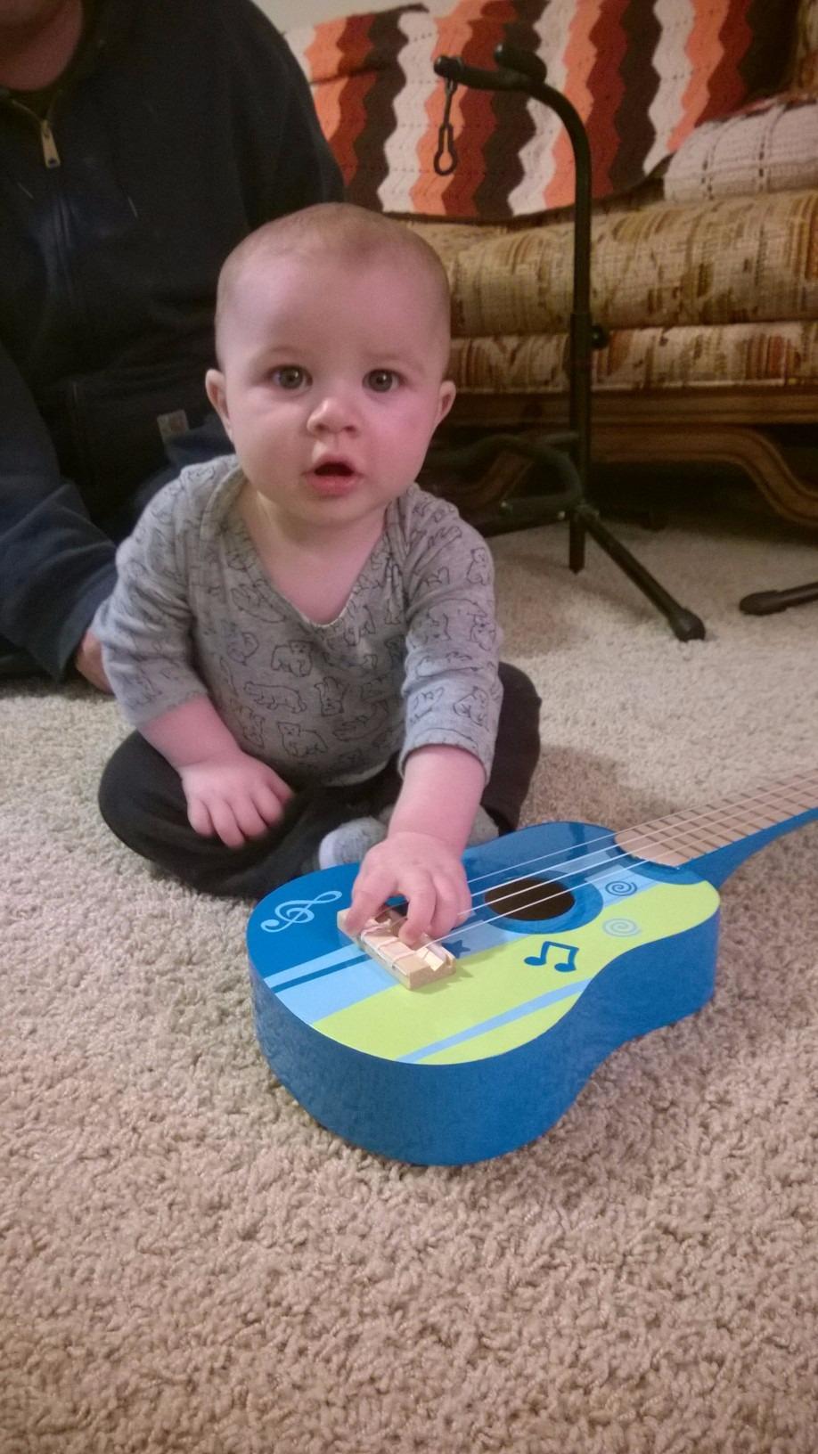 Hape Kid's Wooden Toy Ukulele, Red customer photo 1