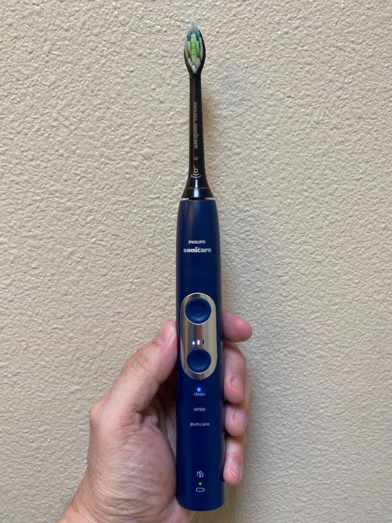 ProtectiveClean 6100 Rechargeable Electric Toothbrush, with Pressure Sensor, 3 Cleaning Modes, SmarTimer and QuadPacer, 14-Day Battery Life, Travel Case, White, Model HX6877/21 customer photo 1