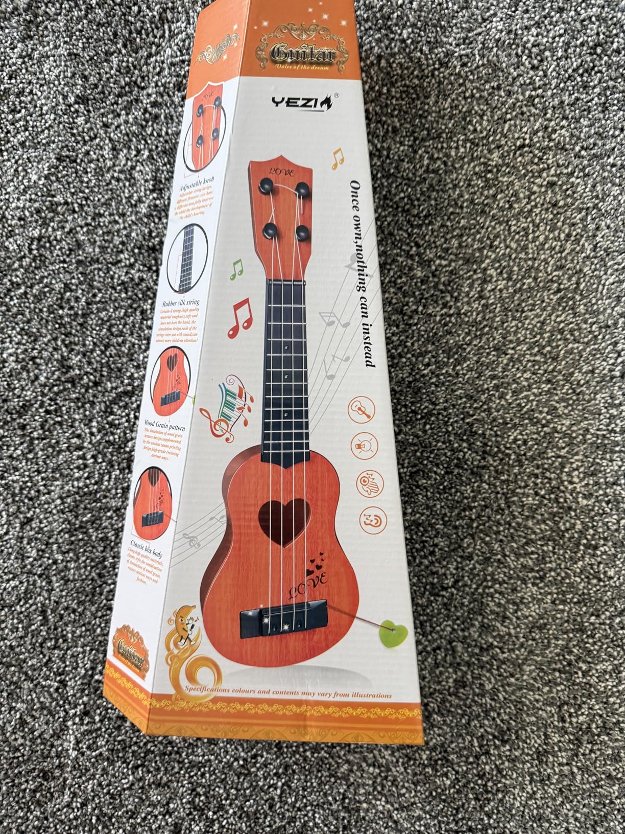 YEZI Classical Ukulele for Kids, Mini Toddler Guitar Toy with Pick, Educational Musical Instrument for Preschool Boys Girls, Early Learning Music Toy for Ages 3 4 5 6+ Years Old, Brown customer photo 2