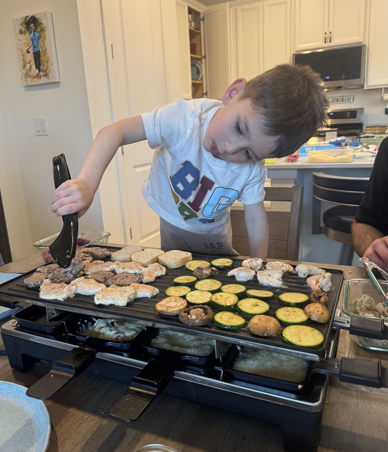 Raclette Grill, Techwood Electric Indoor Grill with 2 Reversible Non-stick Grill Griddle Plates, 1 Stone Grill Plate, 1500W Fast Heating with 8 Cheese Pans, Ideal for Parties and Family Fun, Black customer photo 1