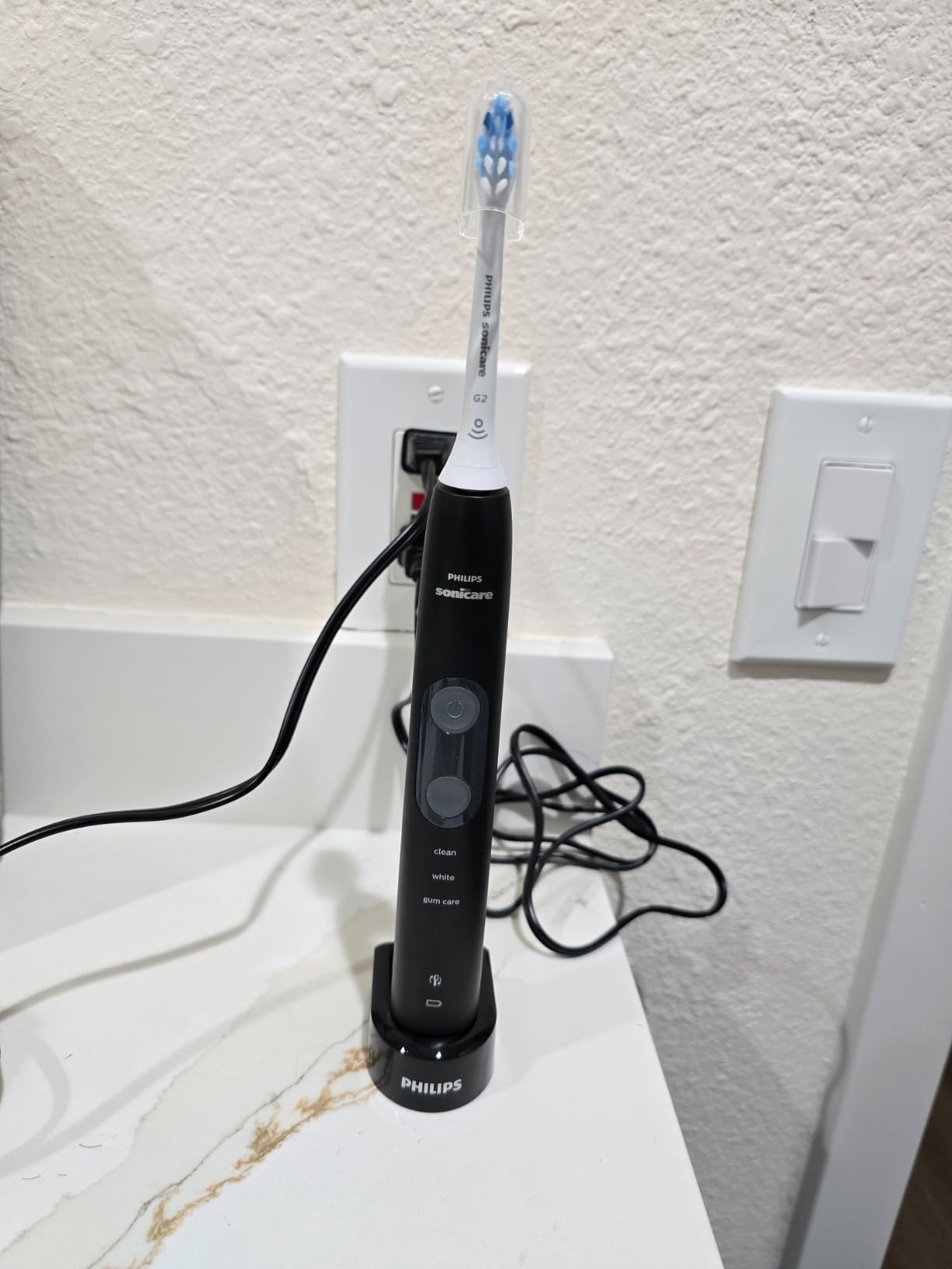 ProtectiveClean 5100 Rechargeable Electric Toothbrush, with Pressure Sensor, 3 Cleaning Modes, SmarTimer and QuadPacer, 14-Day Battery Life, Travel Case, Black, Model HX6850/60 customer photo 1
