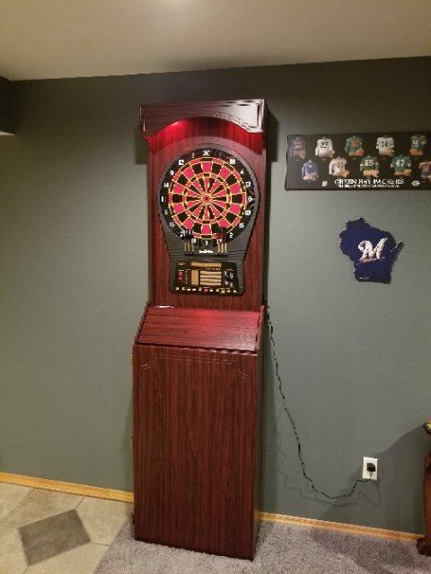 Arachnid Freestanding Cabinet Set: Includes Cricket Pro 800 regulation board in a stylish cabinet with shelves. Offers 40 games, 8-player LED scoring, tri-color Cricket, and 6 darts customer photo 1