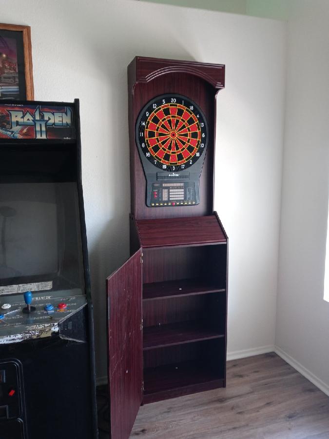 Arachnid Freestanding Cabinet Set: Includes Cricket Pro 800 regulation board in a stylish cabinet with shelves. Offers 40 games, 8-player LED scoring, tri-color Cricket, and 6 darts customer photo 2