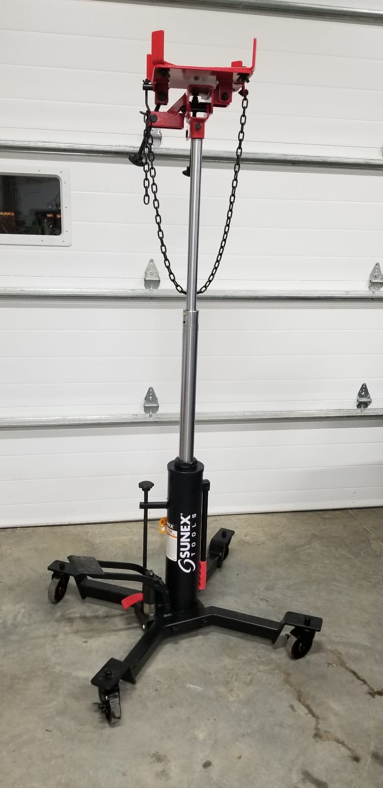 Sunex Tools 7793B 1,000 lb Telescopic Transmission Jack, Hydraulic, Foot Pump Operated, Tilt Saddle with Chain Tie-Down, 74.2 in Max Height customer photo 2