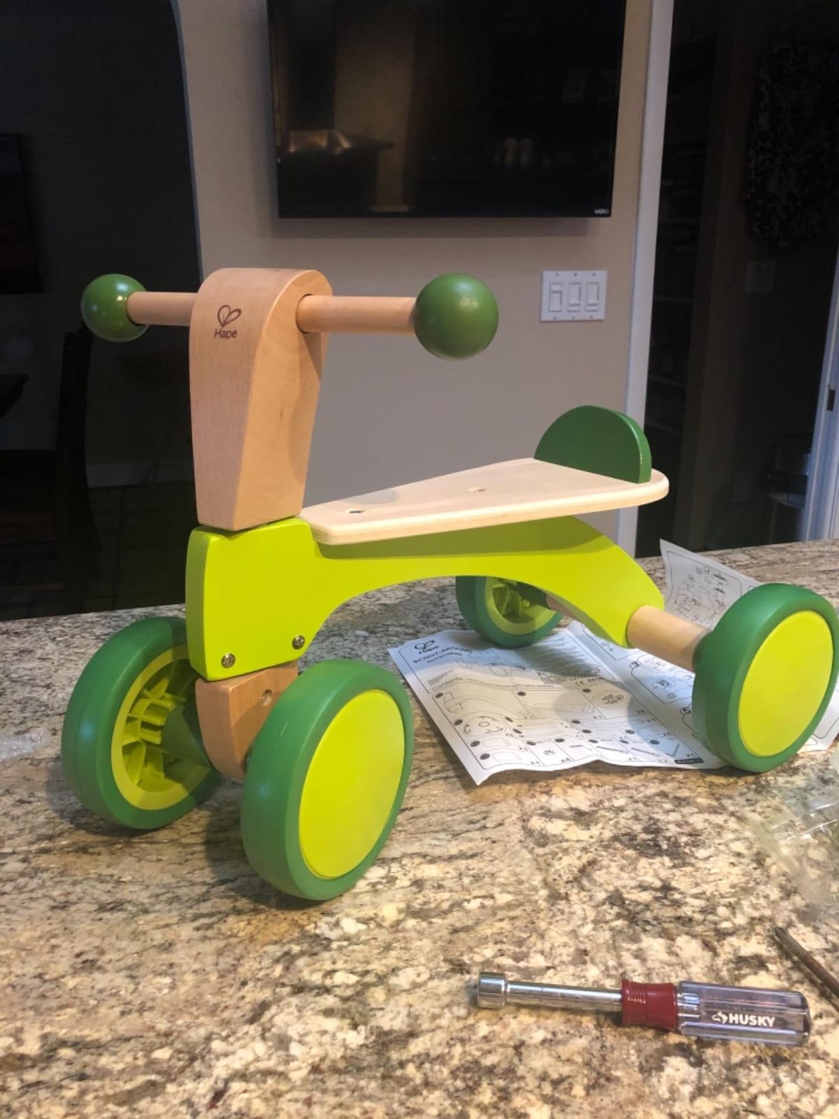 Hape Scoot Around Ride On Wood Bike | Award Winning Four Wheeled Wooden Push Balance Bike Toy for Toddlers with Rubberized Wheels, Bright Green customer photo 2