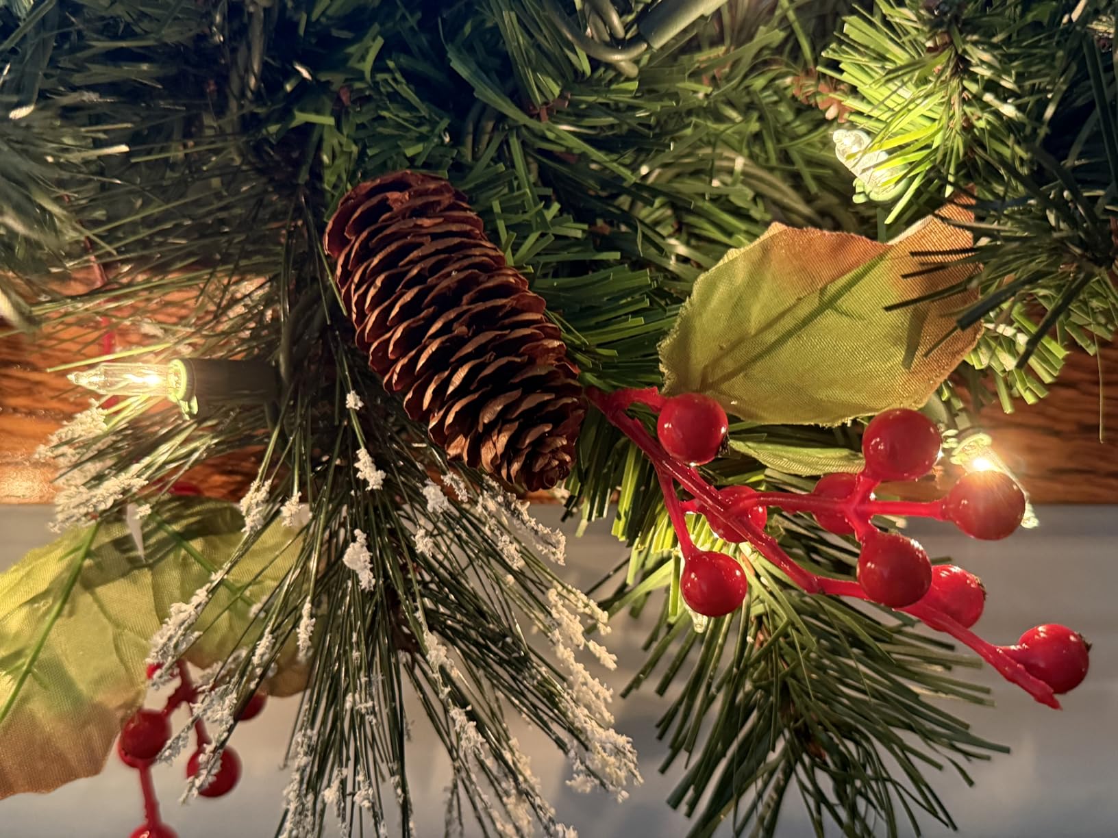 National Tree Company 9 ft Pre-Lit Wintry Pine Flocked Artificial Christmas Garland, Christmas Decoration with Pinecones, Red Berries, 100 Clear Lights, 184 Tips, Green customer photo 1