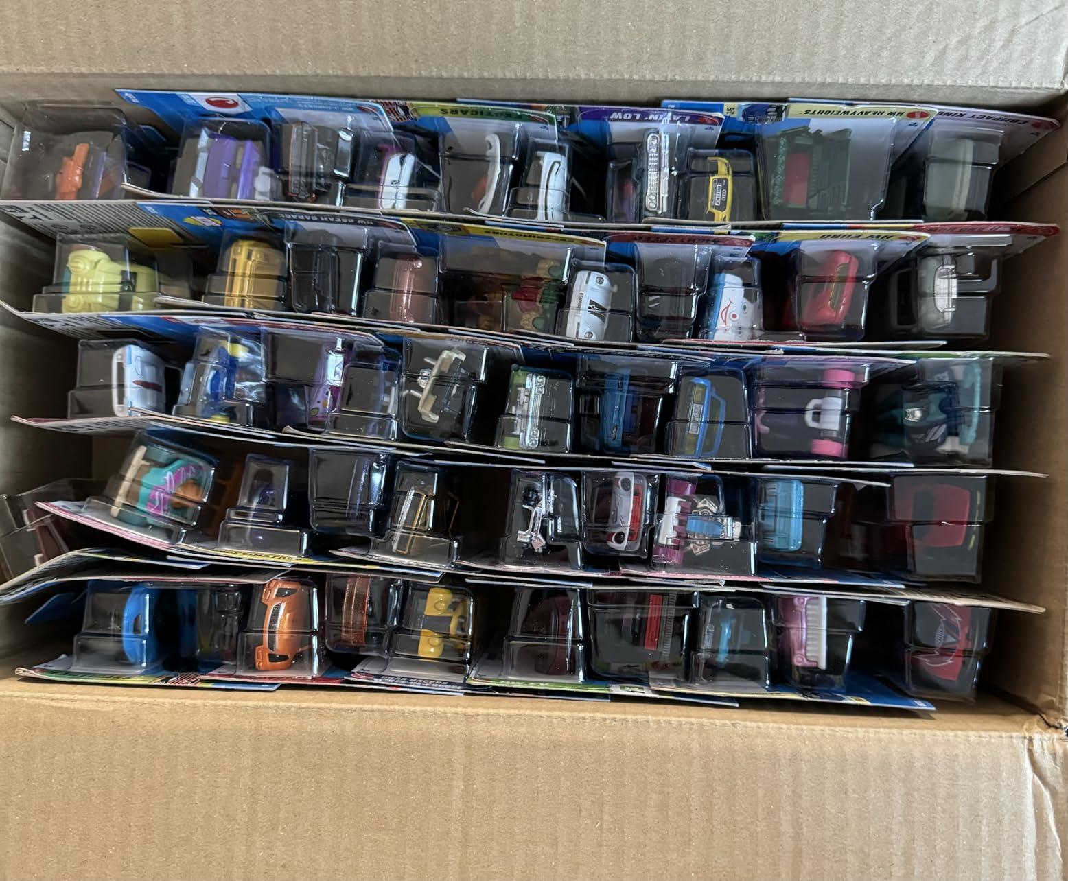 Hot Wheels Toy Cars & Trucks 20-Pack, Set of 20 1:64 Scale Vehicles for Play or Display, Instant Collection (Styles May Vary) customer photo 1
