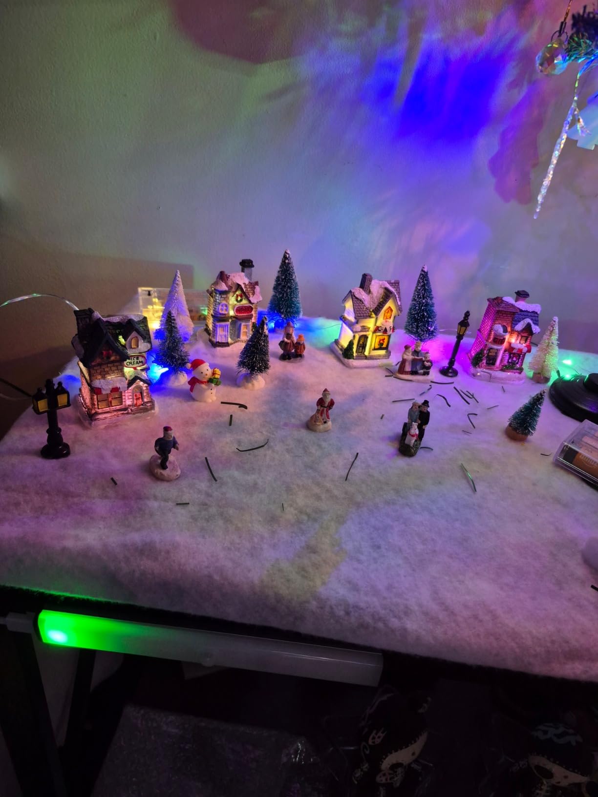 Gerrii 31 Pcs Christmas Village Figurines Decoration Set Lighted LED Christmas Village Houses with Figurines Snow Blanket Roll for Xmas Town Scene Desk Battery Operated Landscape Decor(Santa) customer photo 1