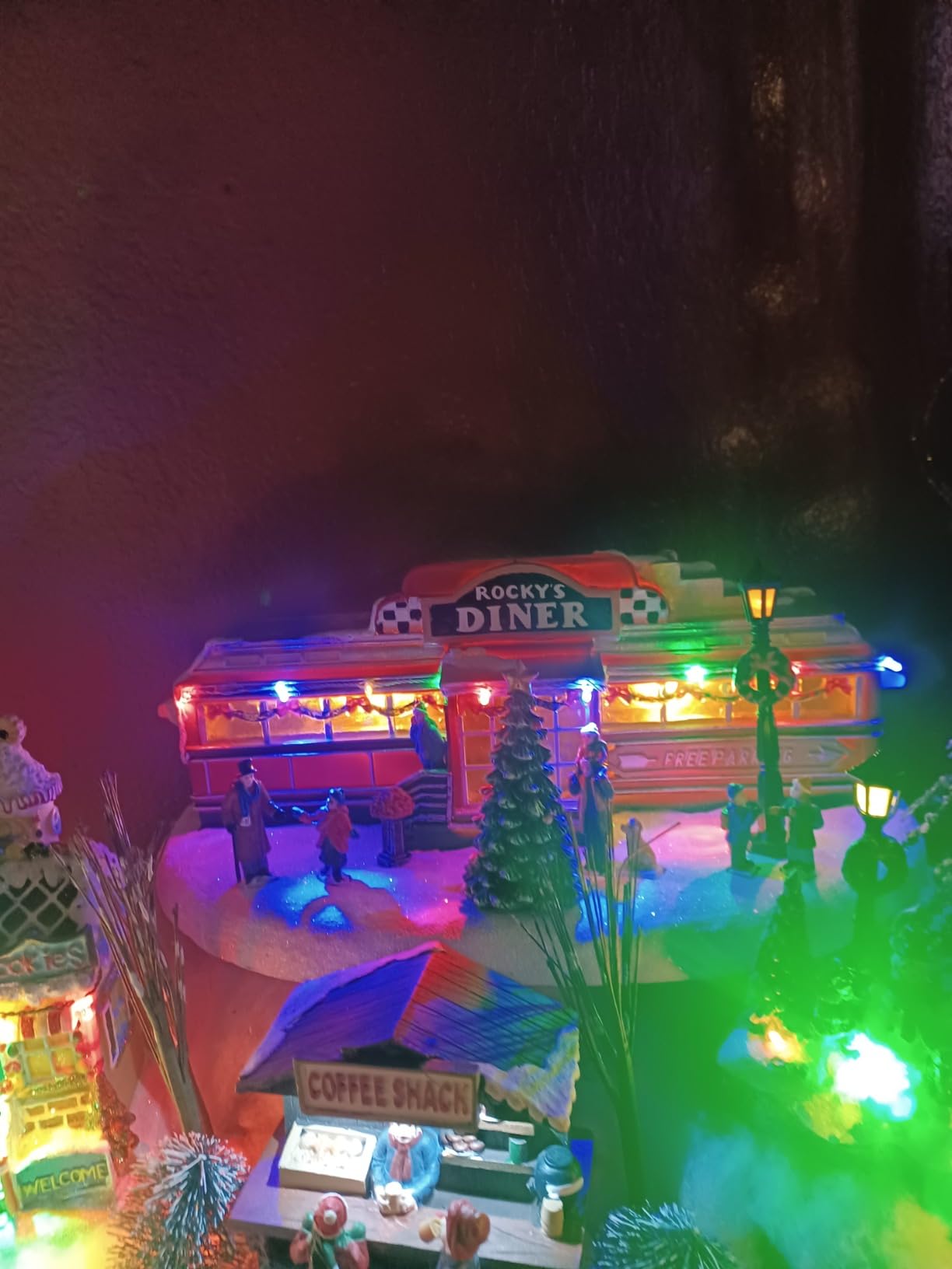 Christmas Village Building, Rocky's Diner, Retro 1950's Diner with LED Lights and Christmas Music - Battery Operated (not included) (optional 4.5V adapter not included) (5.8in H x 13.6in W x 7.1in D) customer photo 1