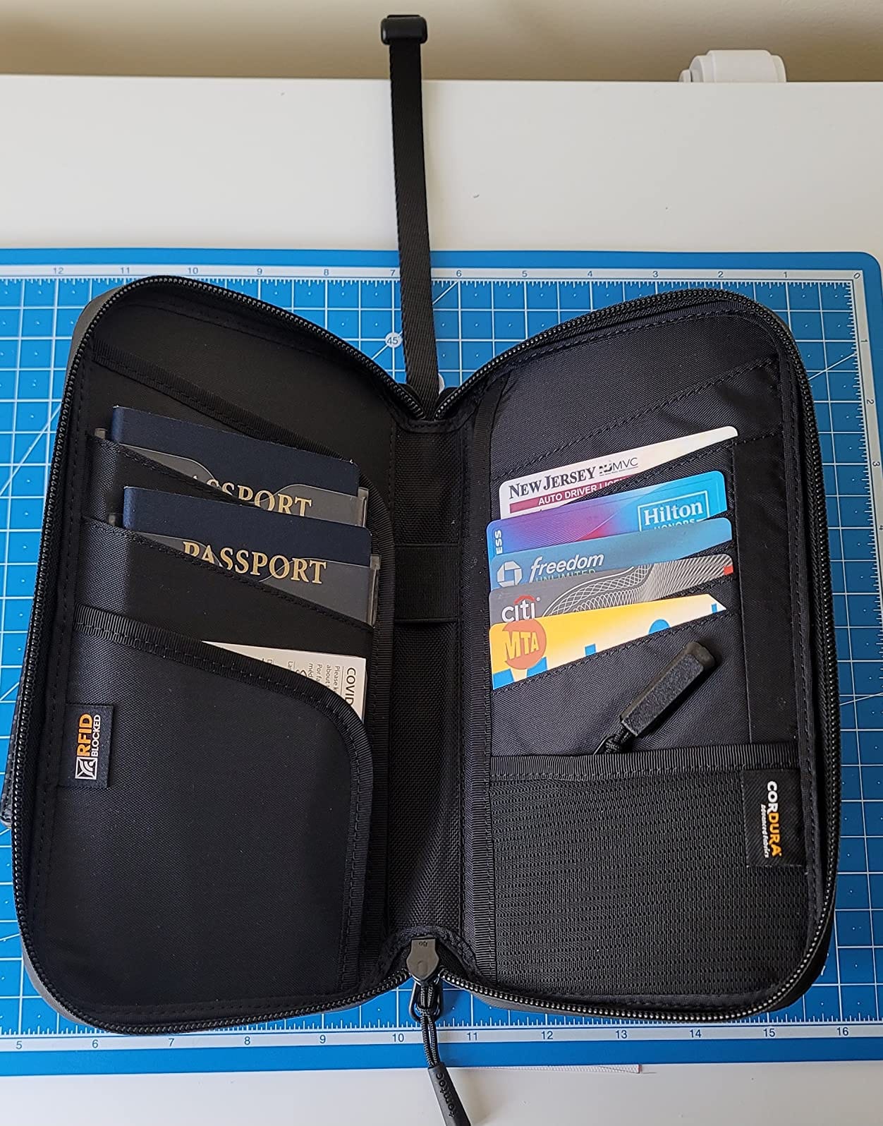 Passport Holder Family with RFID Blocking, Passport Wallet Women Men, with Airtag & Sim Card Holder and Eject Pin, Travel Document Organizer with Wrist Strap, Up to 4 Passports, Water-resistant customer photo 1