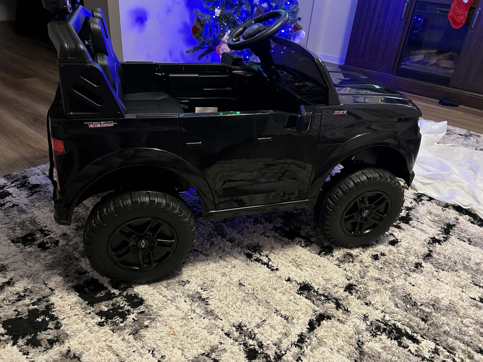 ENYOPRO 24V Ride on Toys, Licensed Chevrolet Silverado LT Trail Boss 2 Seater Ride on Car for Kids, Toddler Electric Car w/Remote Control, Safety Belt, Truck Bed Storage, LED Lights, Bluetooth, Black customer photo 1