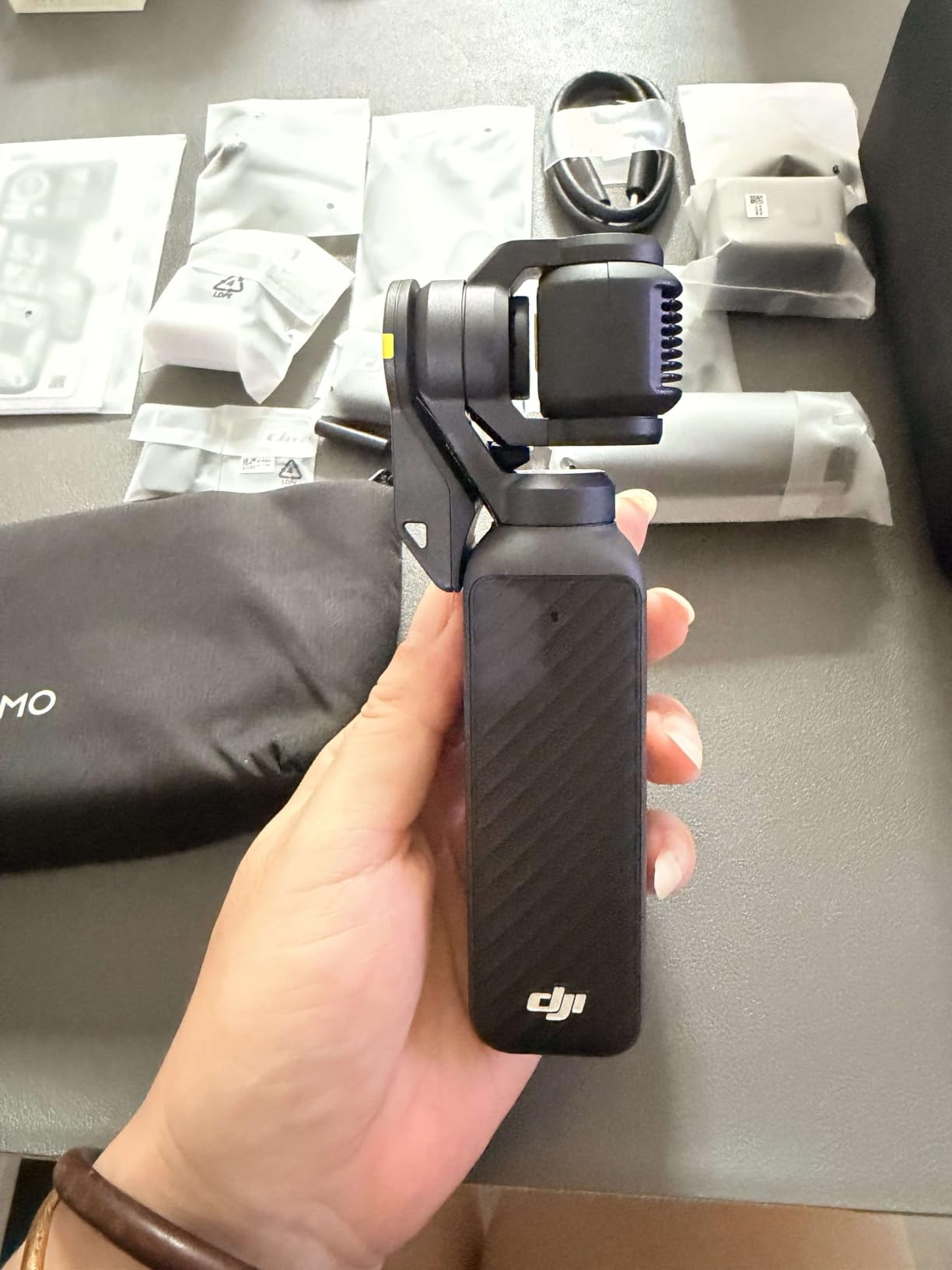 DJI Osmo Pocket 4 Creator Combo, Pocket Gimbal Vlog Camera customer photo 1